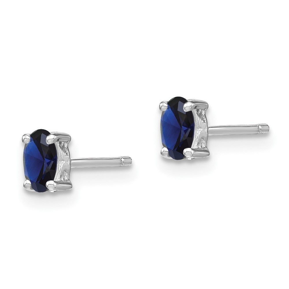 Sterling Silver Rhodium-plated 5x3mm Oval Created Sapphire Post Earrings